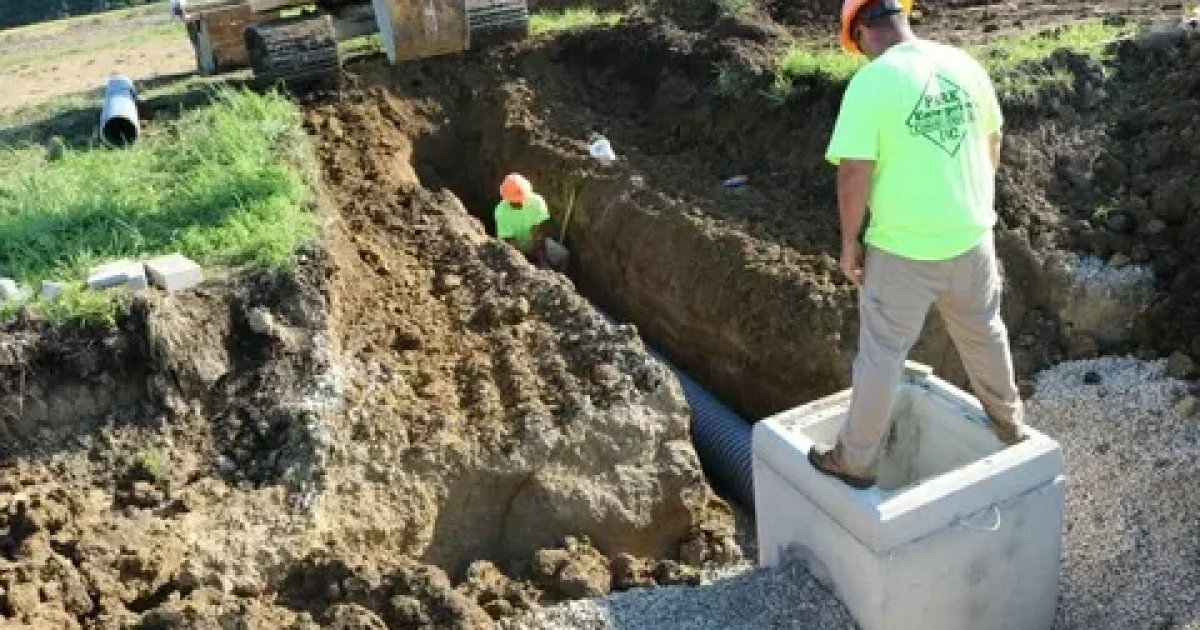 underground utility installation trenching process with excavator